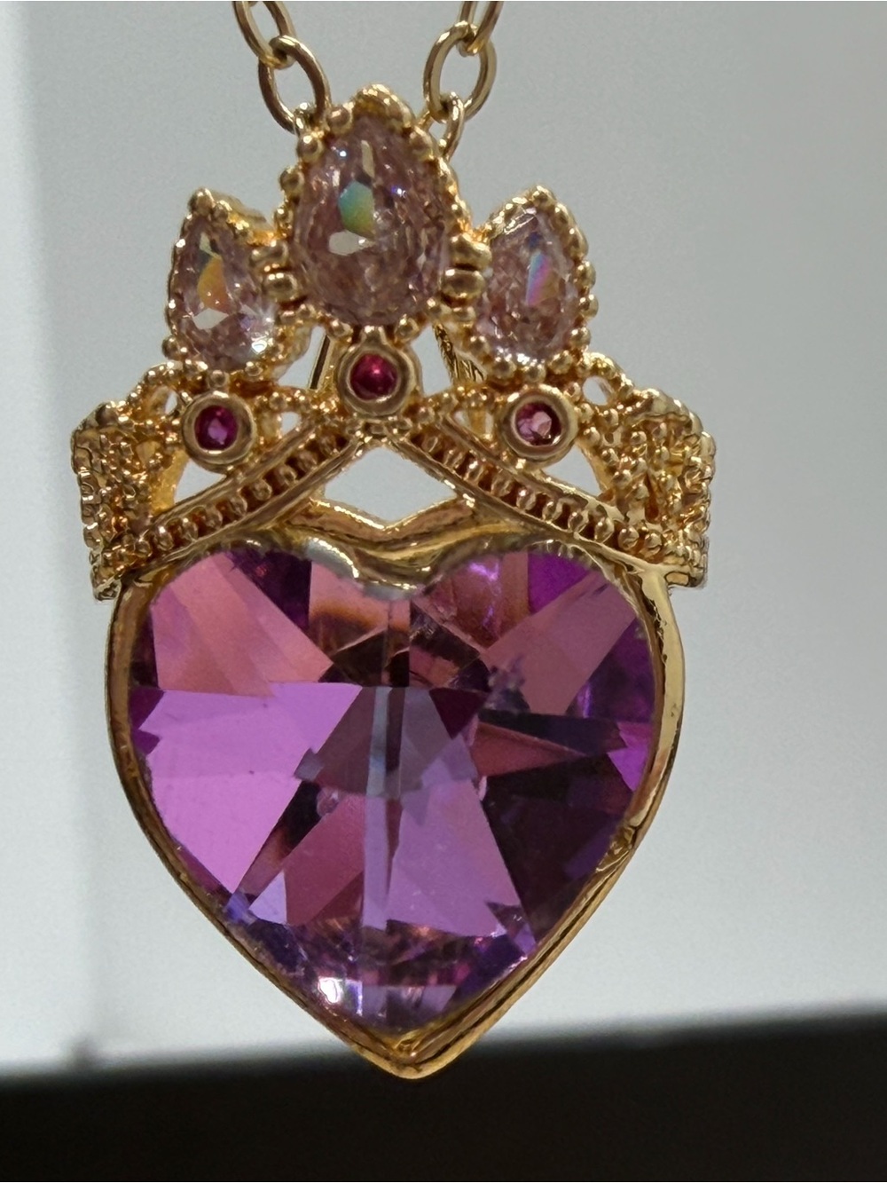 Gold-Tone Heart Pendant Necklace with Purple Crystal and Crown Detail